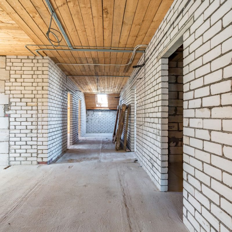 empty interior in house without repair with white silicate brick walls